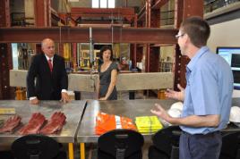 PhotoID:14575, After confirming the merger funding. VC Scott Bowman and Member for Capricornia Kirsten Livermore chat with CQUniversity staff member Ray Kearney in an Engineering workshop