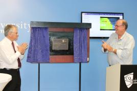 PhotoID:13397, Chancellor Rennie Fritschy applauds as MP Warren Entsch opens the Centre in Cairns