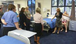 PhotoID:12629, Director of Centre for Professional Health Education Deborah Austen shows local Managers around the Nursing labs