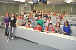 PhotoID:10824, Desktop publishing students (foreground) prepare to gain project design feedback from visiting primary schoolers