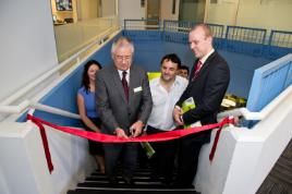PhotoID:14154, Watched by City of Unley Mayor Lachlan Clyne, Chancellor Rennie Fritschy cuts a ribbon to launch the new Centre