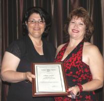 PhotoID:4916, Gillian Adams (right) receives her award from Grace Grace, a prominent union leader recently elected as Member for Brisbane Central