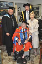 PhotoID:7590, Dr Gold (seated) is congratulated by wife Norma, Deputy Chancellor Charles Ware (centre) and Executive Director Corporate Services Ken Window