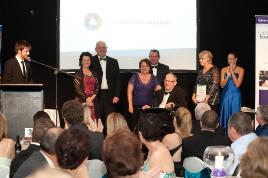 PhotoID:9776, LINK for larger image of Community Solutions staff accepting their award