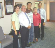 PhotoID:6866, L-R Claire Quaglia (Friendlies), Frank Smith (Qld Gov TradeSmart), Owen Arriola (the assessed nurse), Jenny Anastasi (CQUniversity), Alan Cooper (Director of Nursing for Friendlies)