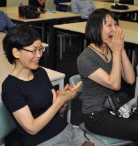 PhotoID:14292, The element of surprise shows on the visitors' faces after the un-masking of Professor Kerry Reid-Searl after a simulated health exercise