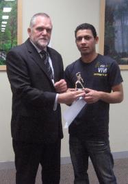 PhotoID:4257, CQU State Director (NSW) Geoff Wessling with competition winner Rabi Karki.