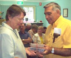 PhotoID:5379, Author Beryl Schneider receiving her CDs from 4YOU President Doug Allwood