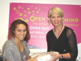 PhotoID:9661, Noosa's Susan Richardson presents the iPad prize to local high school student Tiara Togatia