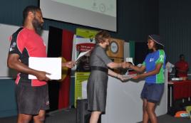 PhotoID:13270, Academic Registrar Barbara Lawrence presenting a Certificate of Participation to an IYSP participant