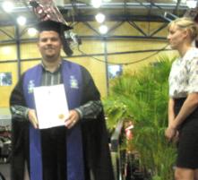 PhotoID:8415, Daniel Bartlett from Facilities Management enjoyed the big night, graduating with an MBA