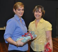 PhotoID:10794, Barbara Miller presents Tameka Bailey with first place in the CQUniversity inaugural bakeoff.