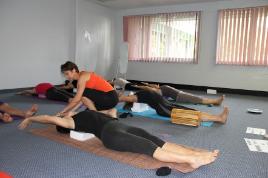 PhotoID:12307, Yoga instructor and CQUniversity staff member Muriel Strahm demonstrates breath work with a student. 