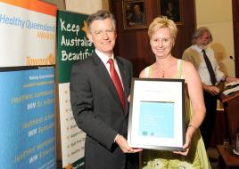 PhotoID:11597, Cathy O'Mullan receives the award from Health Minister Geoff Wilson during a ceremony in Brisbane