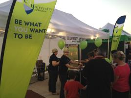 PhotoID:13006, CQUni Emerald Admin officers, Jessie Phelan (Left) and Rayleen Graves (Right) hand out  balloons to the children