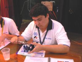 PhotoID:8322, Scholarship holder Phillip Wright helps judge the 2009 Mackay Opti-Minds challenge