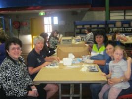 PhotoID:11292, L-R Zonta Mackay's Vassie Comino and CQUniversity's Elaine Jefford (left of table) with Annie Eaton, Amanda McGill and her daughter Evelyn