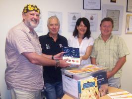 PhotoID:8830, Dr Mike Horsley donating Nursing and Medical textbooks and teaching and learning materials from the Australian National Awards in Excellence in Educational Publishing 2009 to Marc Broadbent, Carol McPherson and Gerry Dares of the Nursing staff at CQUniversity Noosa