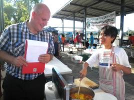 PhotoID:12283, Cooking competition entrant Diana Lu from Taiwan chats with Vice-Chancellor Professor Scott Bowman during the weekend festival