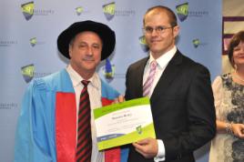 PhotoID:11571, Brendan receives his STEPS completion certificate from Executive Dean Professor Kevin Tickle