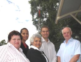 PhotoID:7449, Watching the flag-raising are from left Ros Dunphy (Enrolment & Promotions at Nulloo Yumbah) Robina Mann (Nulloo Yumbah Student Community Liasion Officer), Elder Ethel Speedy, Roger Hunt (CQUniversity Equity & Diversity Officer) and Vice-Chancellor John Rickard.