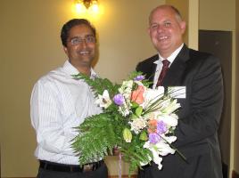 PhotoID:8404, Ajay Krishnamurthy receives his 'best thesis' congratulations from Professor Scott Bowman