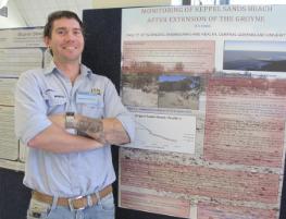 PhotoID:13413, Brenton Connor proudly shows off his final poster presentation