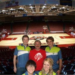 PhotoID:10446, Peter Spencer (centre) with other exchange students from various parts of the globe at the Centrum Basketball Stadium in Cedar City Utah. 