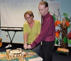 PhotoID:9860, Cutting the cake at the Rockhampton STEPS completion ceremony are Robyn Pointing and Adam Bale