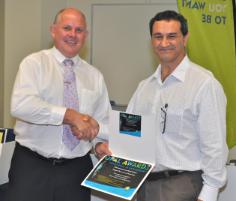 PhotoID:11624, Professor Lee Di Milia (right) accepts his Opal Award from Vice-Chancellor Scott Bowman