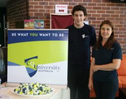 PhotoID:6605, CQUniversity Marketing Coordinator Sheryle Gherardi talks with student Jared Feehely at the open day in Gladstone.