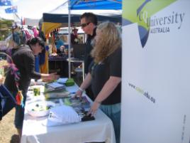 PhotoID:6395, CQUniversity's Christian Tryhorn and Connie Moore were happy with the interest in CQUniversity programs at the festival.