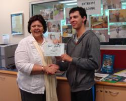 PhotoID:12503, Winner of the Extreme Reading photo competition, Bronson Stoneham pictured with Gladstone Regional Council Mayor Gail Sellers