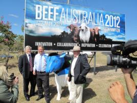 PhotoID:11201, Deputy VC Alastair Dawson with Mayor Brad Carter and Beef Australia Chairman Geoff Murphy, attracting media attention at the new billboard