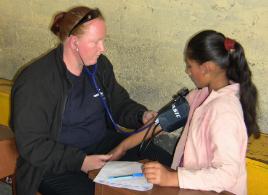 PhotoID:8190, Hands-on assistance - Jodie Cleary takes the blood pressure of one of the local residents.