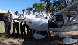 PhotoID:10990, Deng with Aviation senior lecturer Ron Bishop and classmates