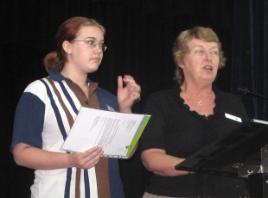 PhotoID:9562, CQUniversity's Beth Tennant presents Cheyenne with her certificate on parade