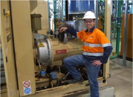 PhotoID:10638, Ben Dinsdale checks one of the three station air compressors at Tarong North power station