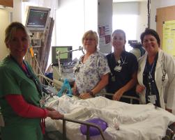 PhotoID:4623, Raina O'Connor (right) with her clinical team leader and charge nurses at Bethesda Memorial Hospital in Florida