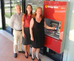 PhotoID:12183, The Sarina Community Bank Branch of Bendigo Bank's board director Ralph Johnson and branch manager Roanna Brady congratulate CQUniversity student Jennifer Hickey on her scholarship, as the University welcomes a new Bendigo Bank ATM on campus. 