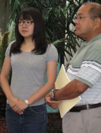 PhotoID:10599, Japanese exchange student Mariko Kakuta and CQUniversity lecturer Naohiko Shimizu talk about the devastation in Japan.