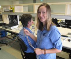 PhotoID:13455, Stephanie Lehmann sets up for an EEG in the campus labs
