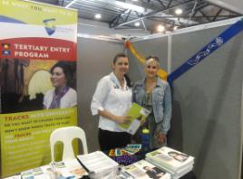 PhotoID:12936, Psychology student Abby Louis (right) helps Ashley Jamieson on the CQUniversity stand