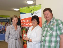 PhotoID:11321, Lecturer Cathy O'Mullan presents an IPod prize to Kathryn and Craig Huckins