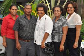 PhotoID:14195, The youngest sister in her family, Charlene Mann (right) celebrates with other family members L-R Robina Mann (second oldest sister), Robert Mann (father), Mae Mann (mother), Melinda Mann-Yasso (oldest sister). Her brothers Malcolm and Robert were absent. Charlene is now studying a Business degree specialising in Tourism. Most of her siblings have pursued higher education through CQUniversity