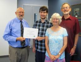 PhotoID:11988, Bundaberg Head of Campus Professor Phillip Clift congratulations Aiden Sibley. Proud parents Serena and John Sibley attended the presentation