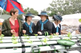 PhotoID:6900, Learning about the hydroponics research at CQUniversity were St Ursula's students Darcy Wilson, Darcy Schnitzerling and Alex Angus. They are being guided by Masters student Elena Churilova