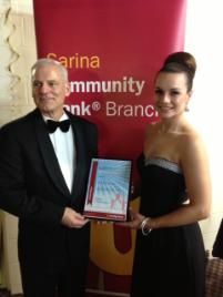PhotoID:14953, Sarina Community Bank Branch Director Ralph Johnson presents Madeleine Morgan with her scholarship. 