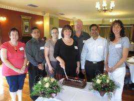 PhotoID:8401, Professor Jennelle Kyd cuts the cake to celebrate higher degree completions by (from left) Debra Harcourt, Shah Haque, Suzanne Craig, Peter Mitchell, Ajay Krishnamurthy and Susan Williams