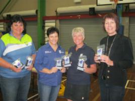 PhotoID:11274, Zonta's Marie Cameron (right) thanks Midwifery academics Annie Eaton (left) and Elaine Jefford (second from right) and Medical Sonography student Amanda McGill (second from left) for helping pack birthing kits. 